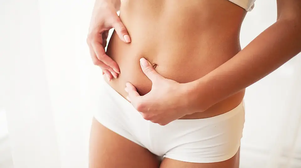 Weight Loss. Closeup Of Hot Sexy Female With Hand Pinching Skin.webp